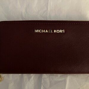 MICHAEL Michael Kors Jet Set Travel Continental Wallet in a rich Merlot color.